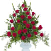 Red roses and premium foliage combine to make this elegant tribute.

