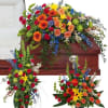 The treasured celebration trio includes a casket spray, standing easel spray and
