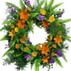 The circular shape of a wreath symbolizes never ending love. Yellow roses
