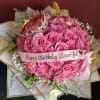 Pink rose bouquet with a birthday ribbon and butterfly decorations