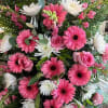 Pink and white mixed flower arrangement with gerbera daisies and roses