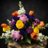 A radiant, garden-style flower arrangement that reads like a joyful celebration in