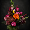 A dramatic, upward-sweeping bouquet that reads like a celebration in color-vivid pink