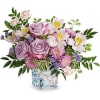 Lavender roses and pink flowers in a square glass vase