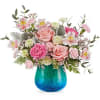 Pink and white mixed bouquet in a blue glass vase