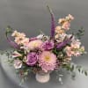 A soft mix of blush roses and seasonal blooms, perfect for celebrating