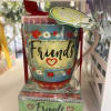 Decorative mug gift set with "Friends" text and floral patterns