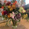 Mixed floral vase with bright local flowers to make anyone smile. 