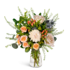 Peach and cream bouquet with roses and a white chrysanthemum in a clear glass vase