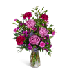 Pink and magenta mixed bouquet in a clear glass vase