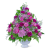 Pink and purple mixed flower arrangement in a white vase