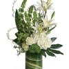 White lilies and roses arranged in a tall green glass vase