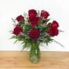 Bouquet of red roses in a clear glass vase