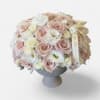 The Ivory Blush is a luxurious garden-style arrangement featuring delicate blush roses