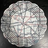Round map-cutout decorative piece with layered black rings
