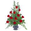 Tall arrangement of red roses in a gray vase
