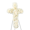 White floral cross-shaped standing arrangement on an easel