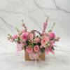 Soft pink roses, gerberas, lilies and white daisies with green accents in