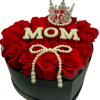 A breathtaking sculptural design featuring premium red roses guarded by a crown