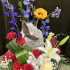 A sculpted eagle plaque stands at the heart of this patriotic flower