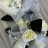 White spray roses, with colored ribbon acent, shown in black but you