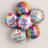 Cluster of colorful Happy Birthday balloons on sticks