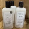 Three bottles of Ivy & Sage lavender chamomile body lotion on a shelf