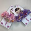 Colorful pom pom ballet scrunchies made with soft sheer ribbon and playful