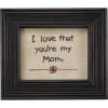 A timeless piece of framed stitchery featuring an embroidered "I Love That