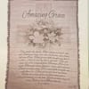 Framed wall hanging with the words "Amazing Grace" and floral artwork