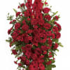 Tall red floral standing spray with roses and carnations