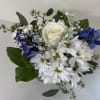 Bouquet of white roses, white daisies, and blue hydrangeas