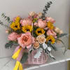 Pink and yellow flower basket with roses and sunflowers