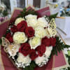 Bouquet of red and white roses with butterfly decorations