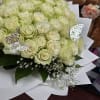 Bouquet of pale cream roses with white baby's breath and butterfly picks