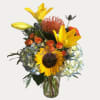 Mixed of sunflowers, lilies, hydrangeas, spray roses, and protea. 