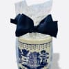 Wrapped decorative candle with a navy bow