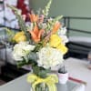 Yellow roses, hydrangeas, snapdragons, alstroeria, solid ago.