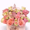 Pink and cream roses in a pale pink gift box with butterfly decorations