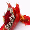 Bouquet of red roses with white baby's breath in red wrapping