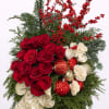 A true expression of holiday romance. This stunning arrangement features radiant red