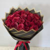 A dense dome of 25 deep red roses makes an immediate, romantic