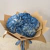 A cloudlike cluster of blue hydrangeas makes an immediate, calming impression-perfect as