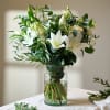 The crisp whites paired with natural greens evoke purity and calmness