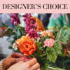 Handheld bouquet with orange and pink flowers