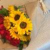 6 exquisite long stem red roses coupled with 6 striking medium sunflowers