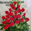 Tall bouquet of red roses with baby's breath and greenery