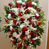 Large standing floral spray with red and white flowers