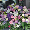 Large mixed bouquet of pink, white, and purple flowers