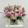 Pink and lavender mixed bouquet in a clear glass vase